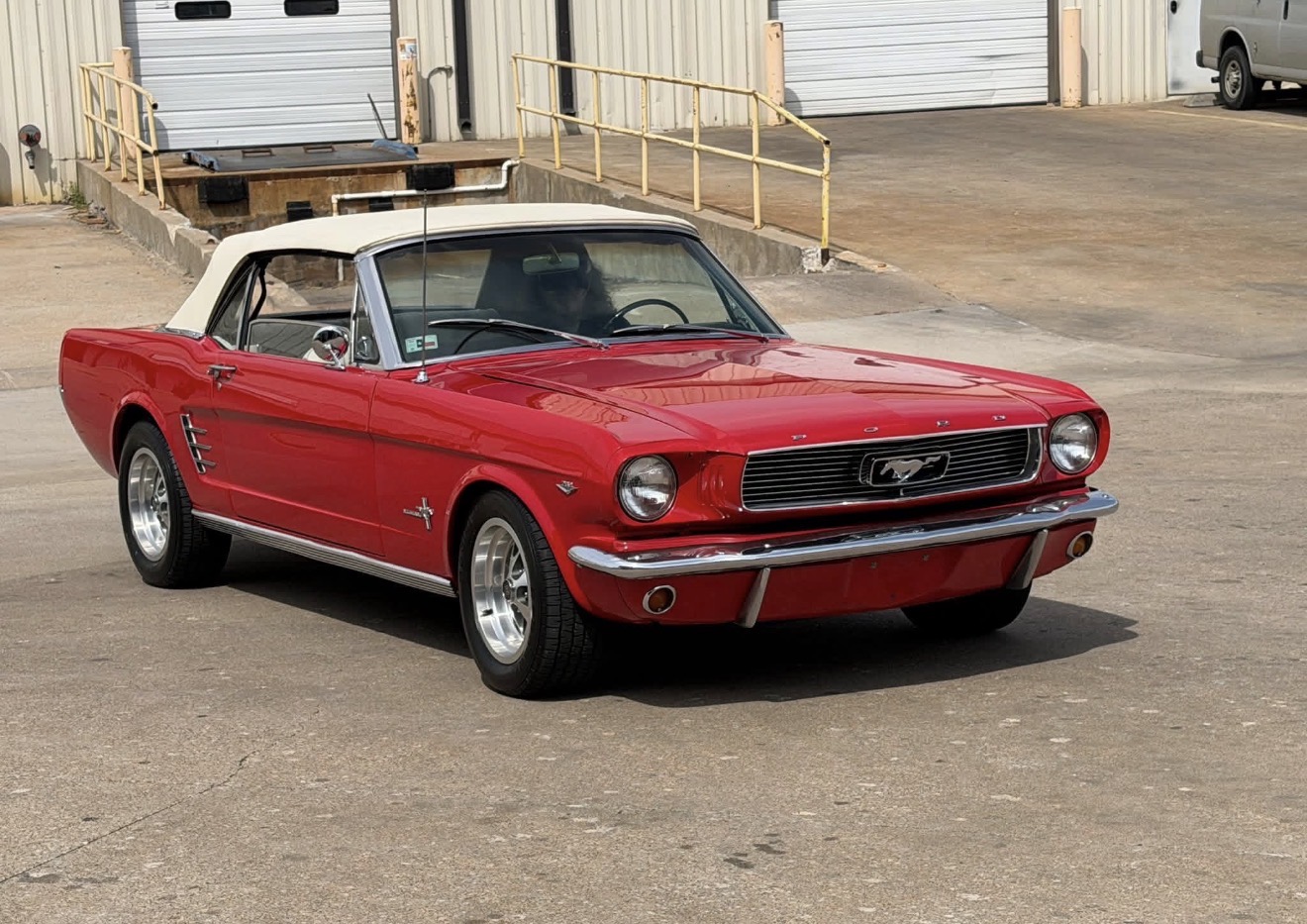 Red 1966 Ford Mustang convertible after restoration